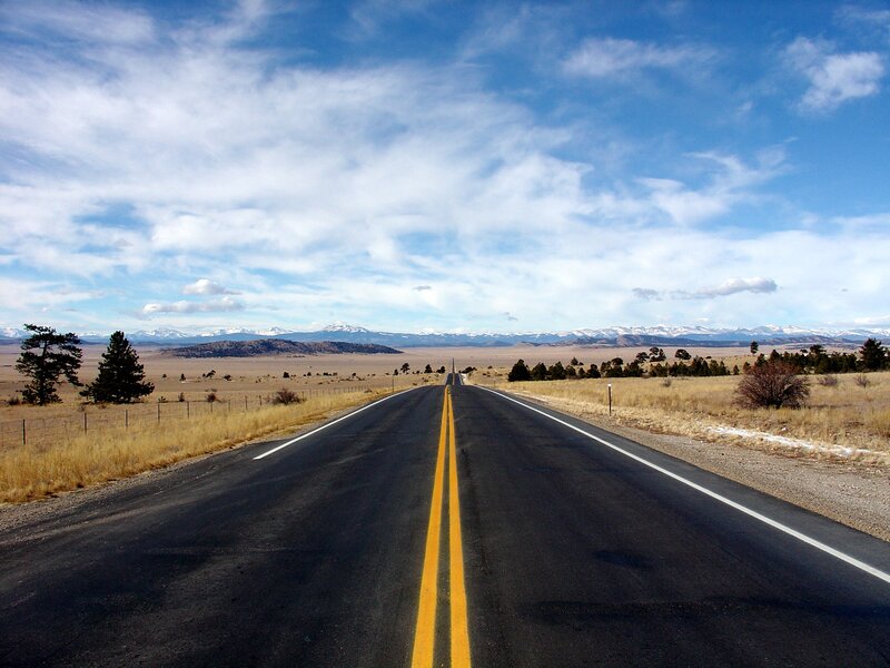 Long road to snow-capped mountains