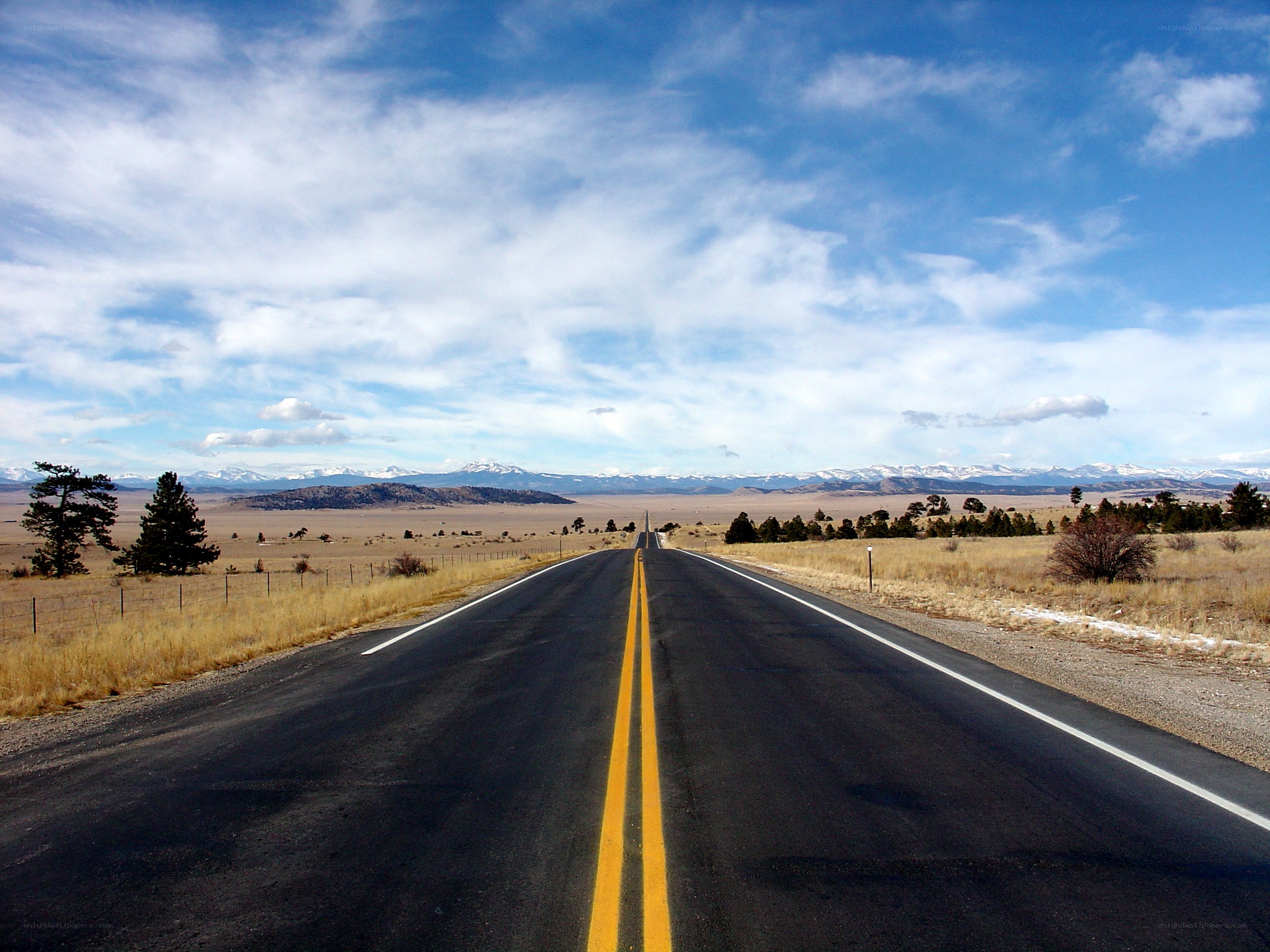 Long road to snow-capped mountains