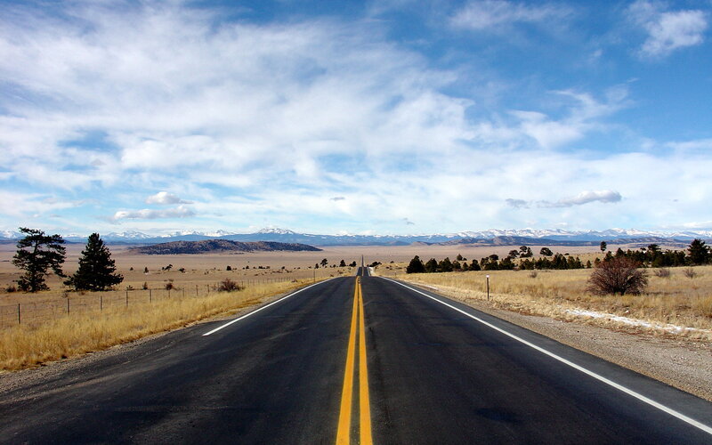Long road to snow-capped mountains