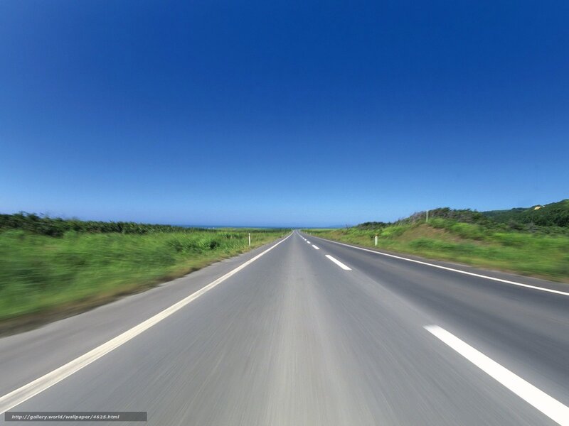 Long road under blue sky