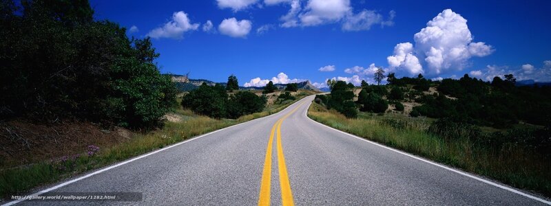 Long road under blue sky