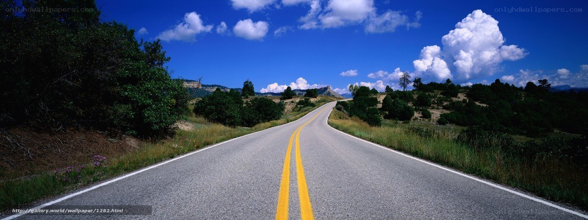 Long road under blue sky