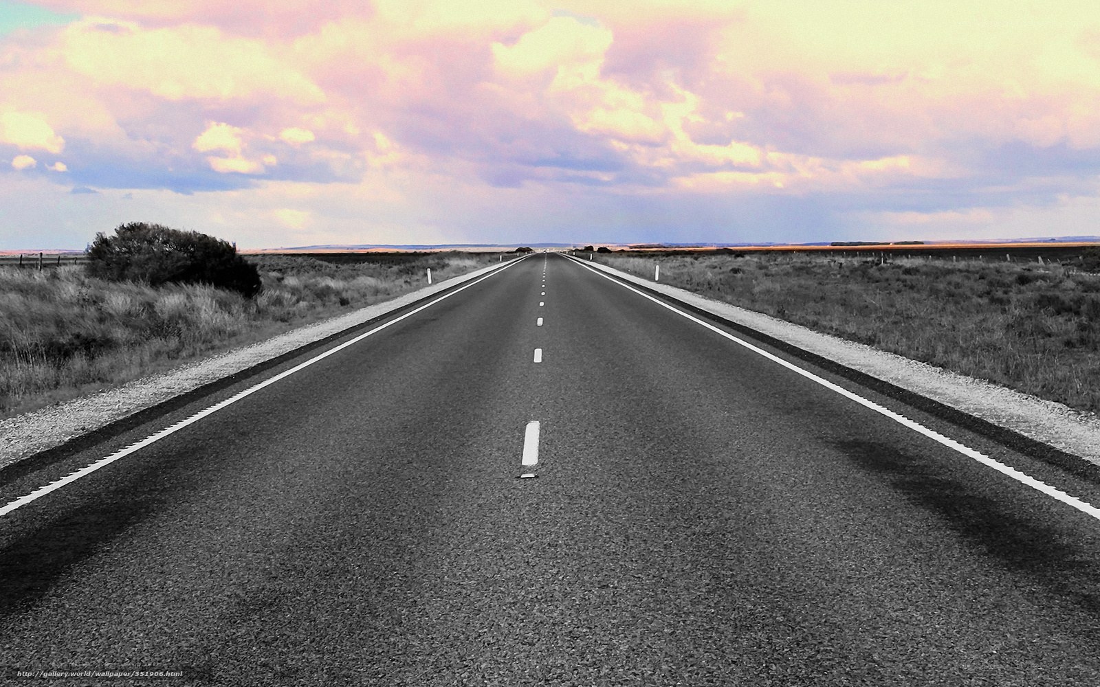 Long road under colorful sky
