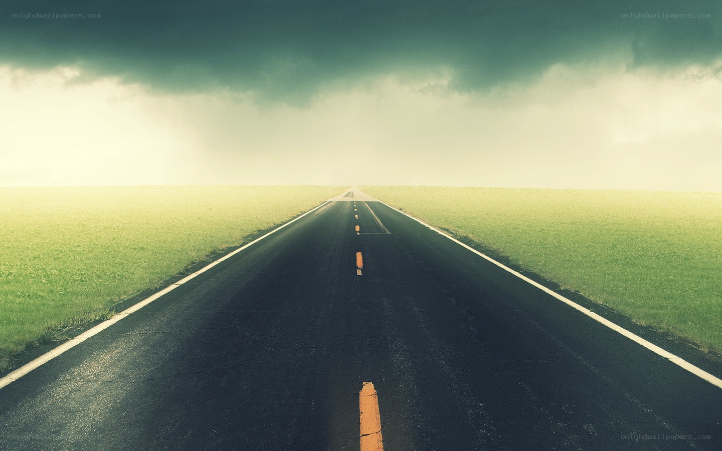 Long road under stormy sky