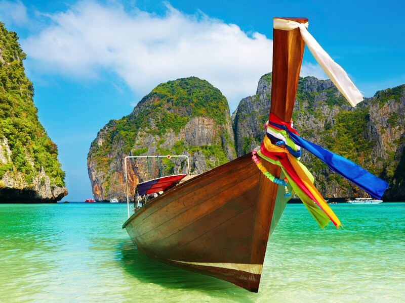 Long-tail Boat in Bay — Blue