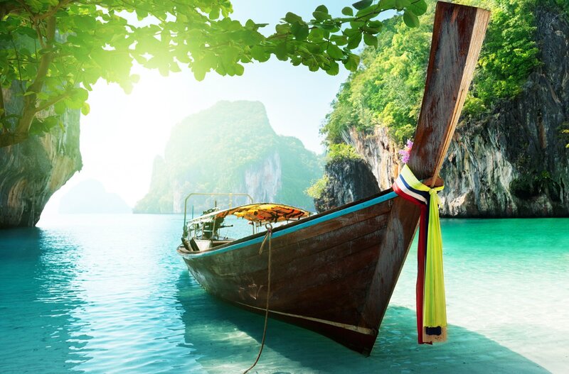Long-tail boat in tropical bay
