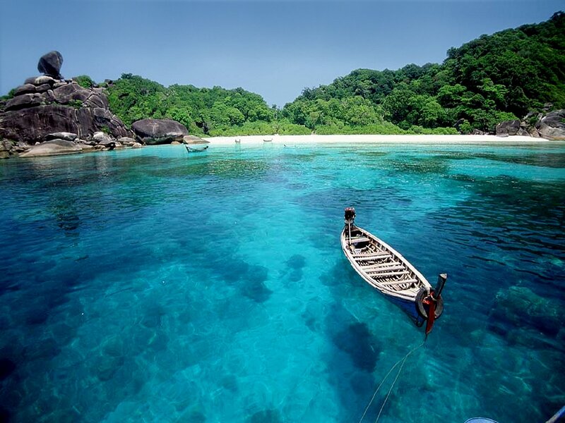 Long-tail Boat in Turquoise Water — Blue