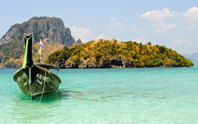 Long-tail Boat in Turquoise Water — Serene