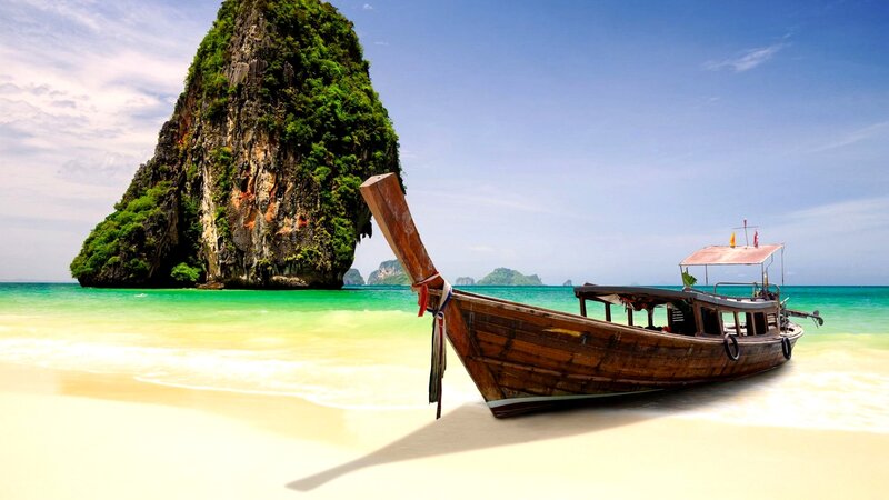 Long-tail Boat on Beach — Blue, Serene, Afternoon, Photograph, Rock Formation