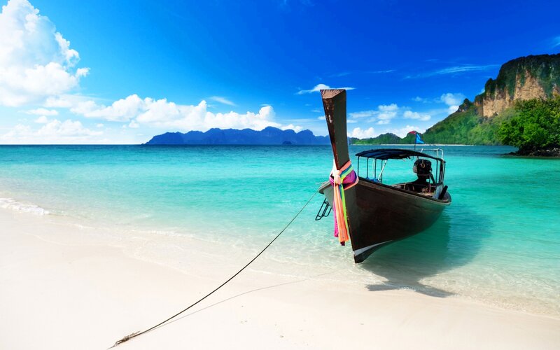 Long-tail Boat on Beach — Blue, Serene, Afternoon, Photograph, Sea