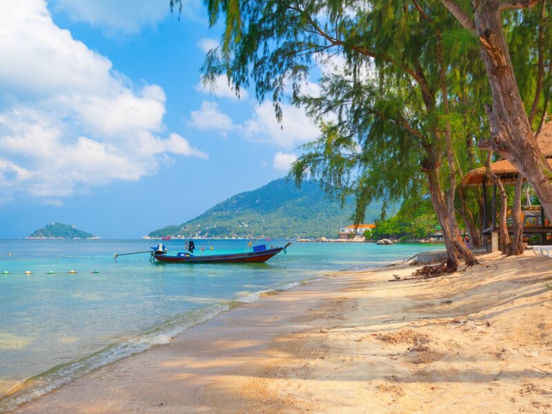 Long-tail Boat on Beach — Blue, Serene, Afternoon, Photograph, Trees, Island