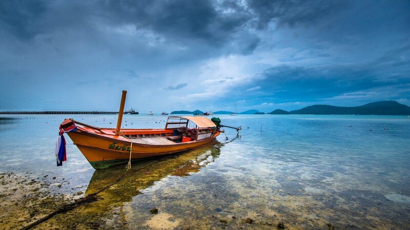 Long-tail Boat on Shore — Blue