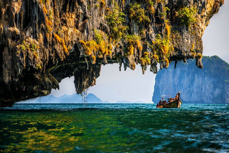 Long-tail Boat under Cliff