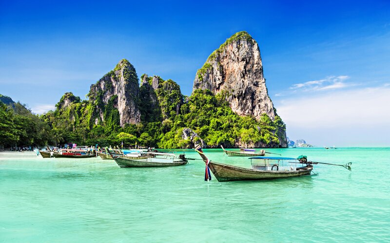Long-tail Boats in Turquoise Water — Blue