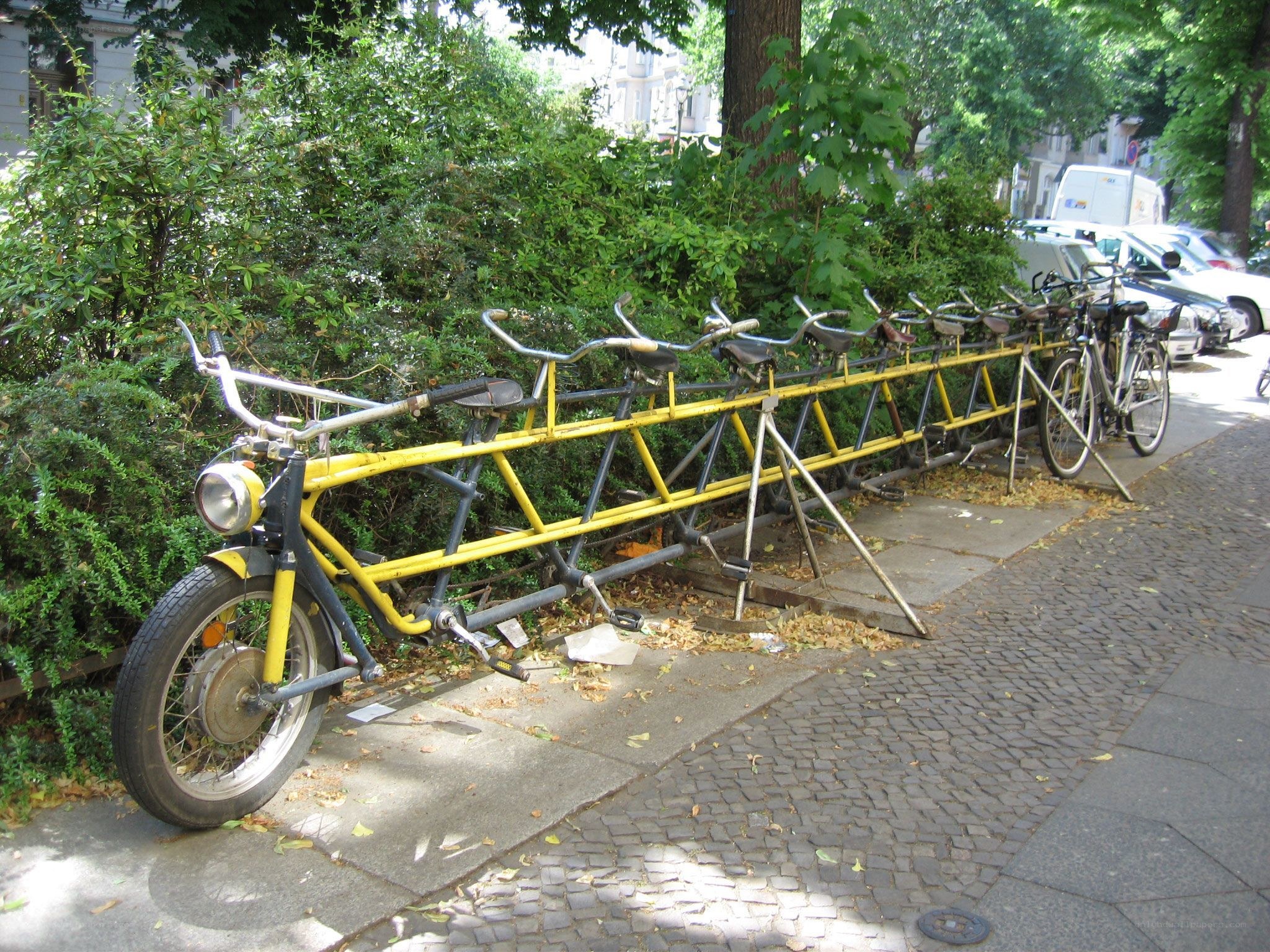 Long tandem bicycle on sidewalk