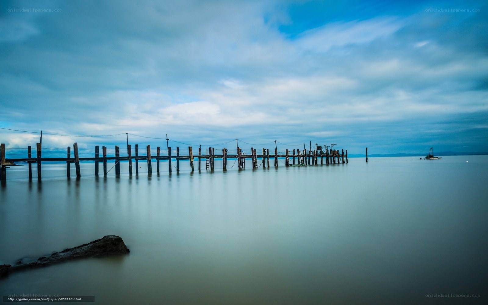 Long wooden pier at dusk