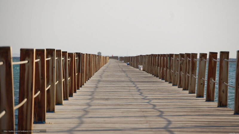 Long wooden pier over the sea