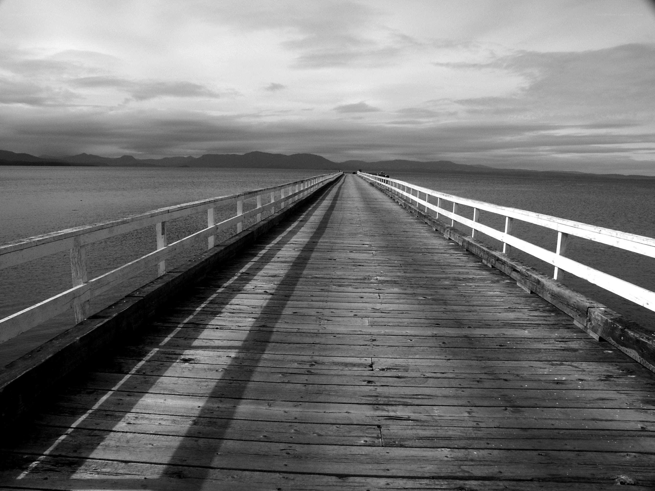 Long wooden pier over water