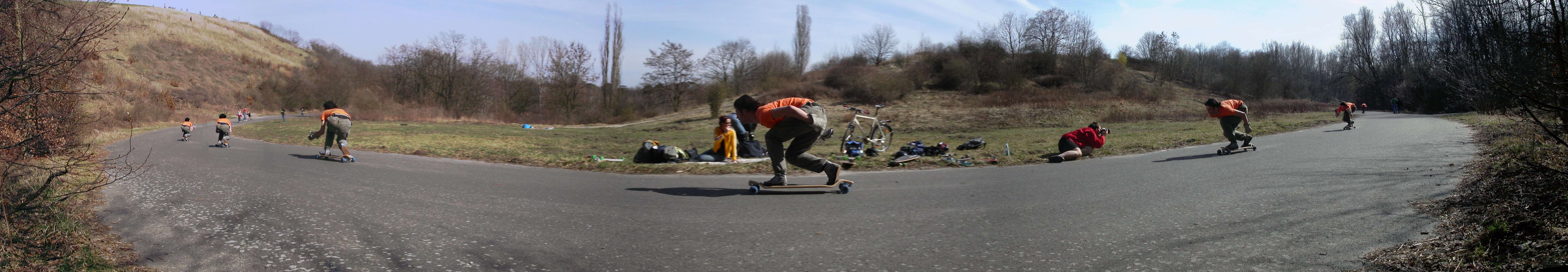 Longboarders on a winding road