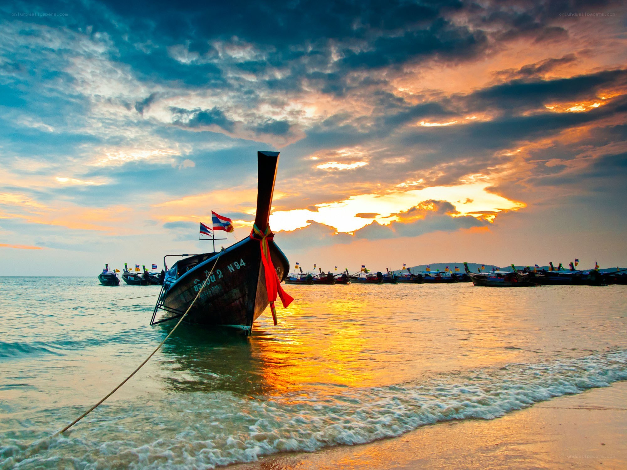 Longtail boat at sunset