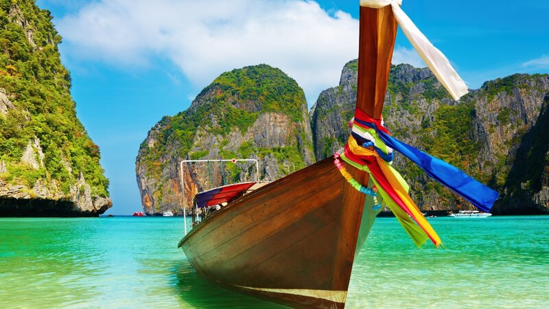 Longtail Boat in Bay — Blue, Serene, Afternoon, Photograph, Cliffs, Boats