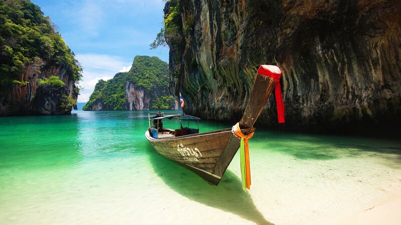 Longtail Boat in Bay — Green, Serene, Afternoon, Photograph, Cliffs, Sea