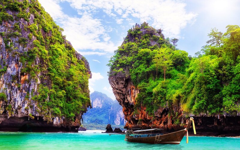 Longtail Boat in Bay — Green, Serene, Afternoon, Photograph
