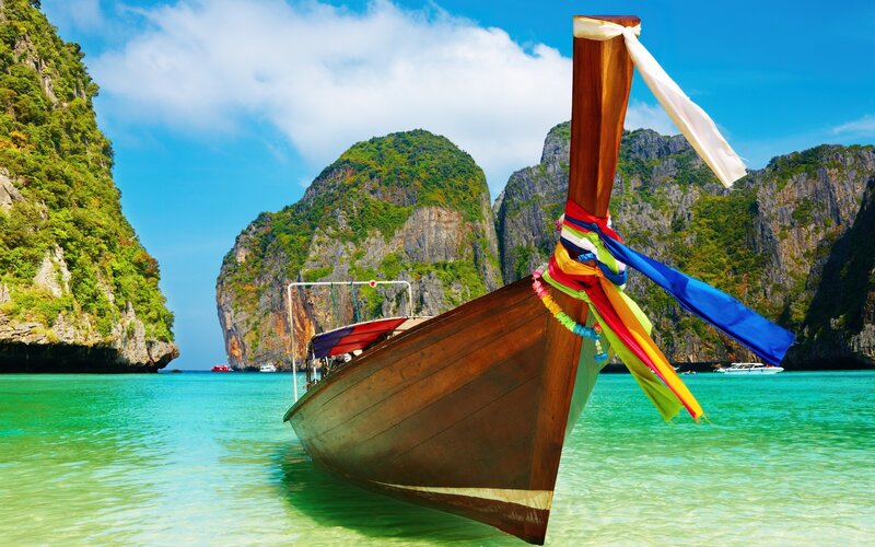 Longtail boat in tropical bay