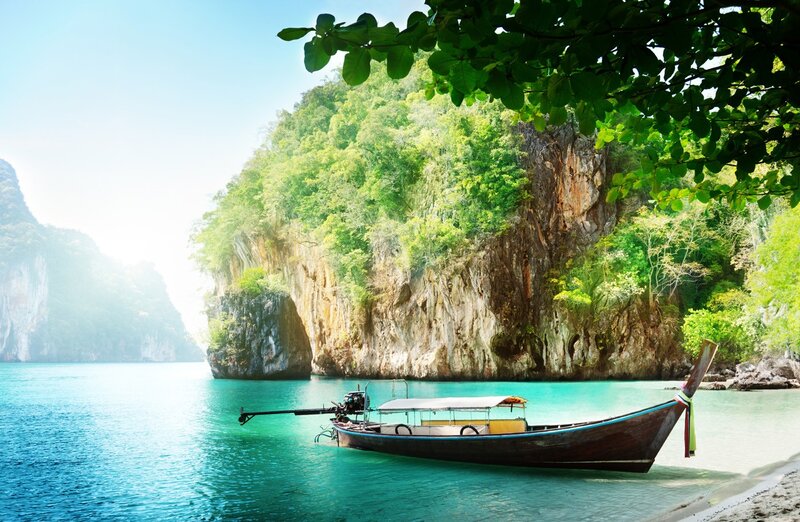 Longtail boat in tropical bay