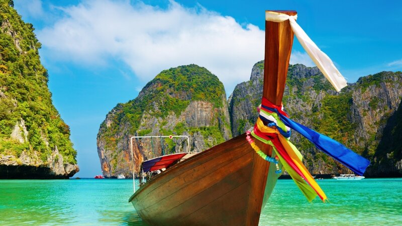 Longtail boat in tropical bay