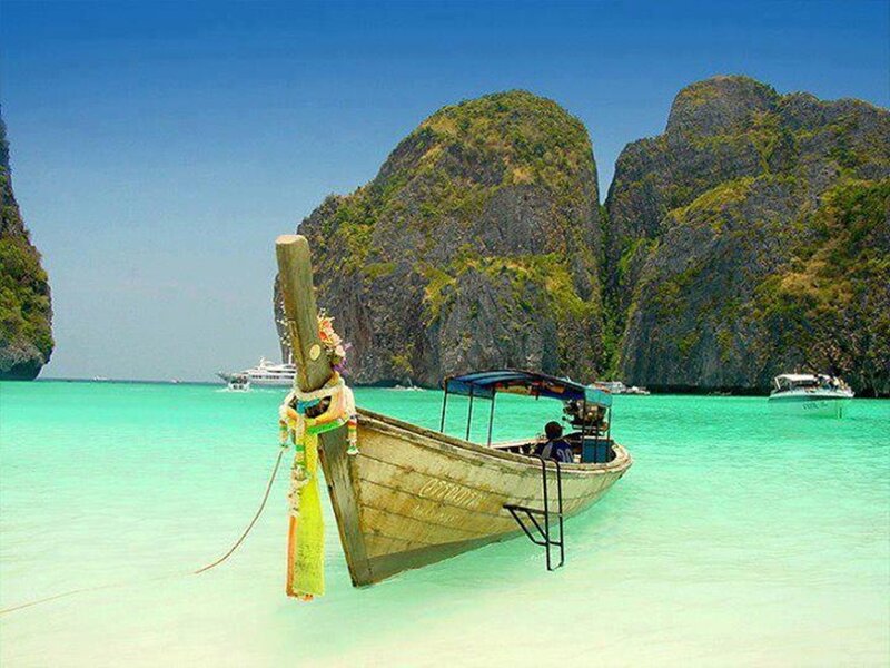 Longtail Boat in Turquoise Water — Blue, Serene
