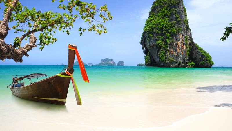 Longtail Boat on Beach — Blue, Serene, Afternoon, Photograph, Tree, Rock Formation