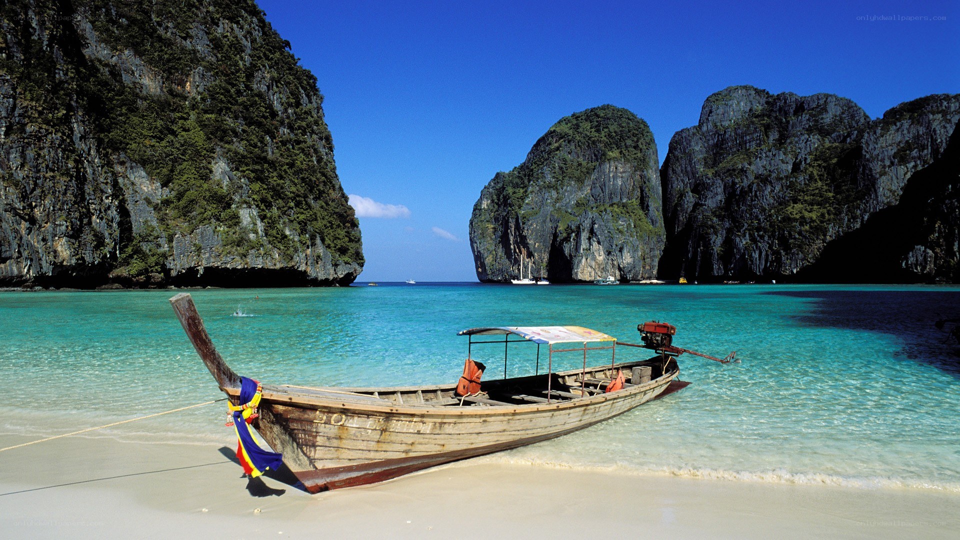 Longtail boat on tropical beach