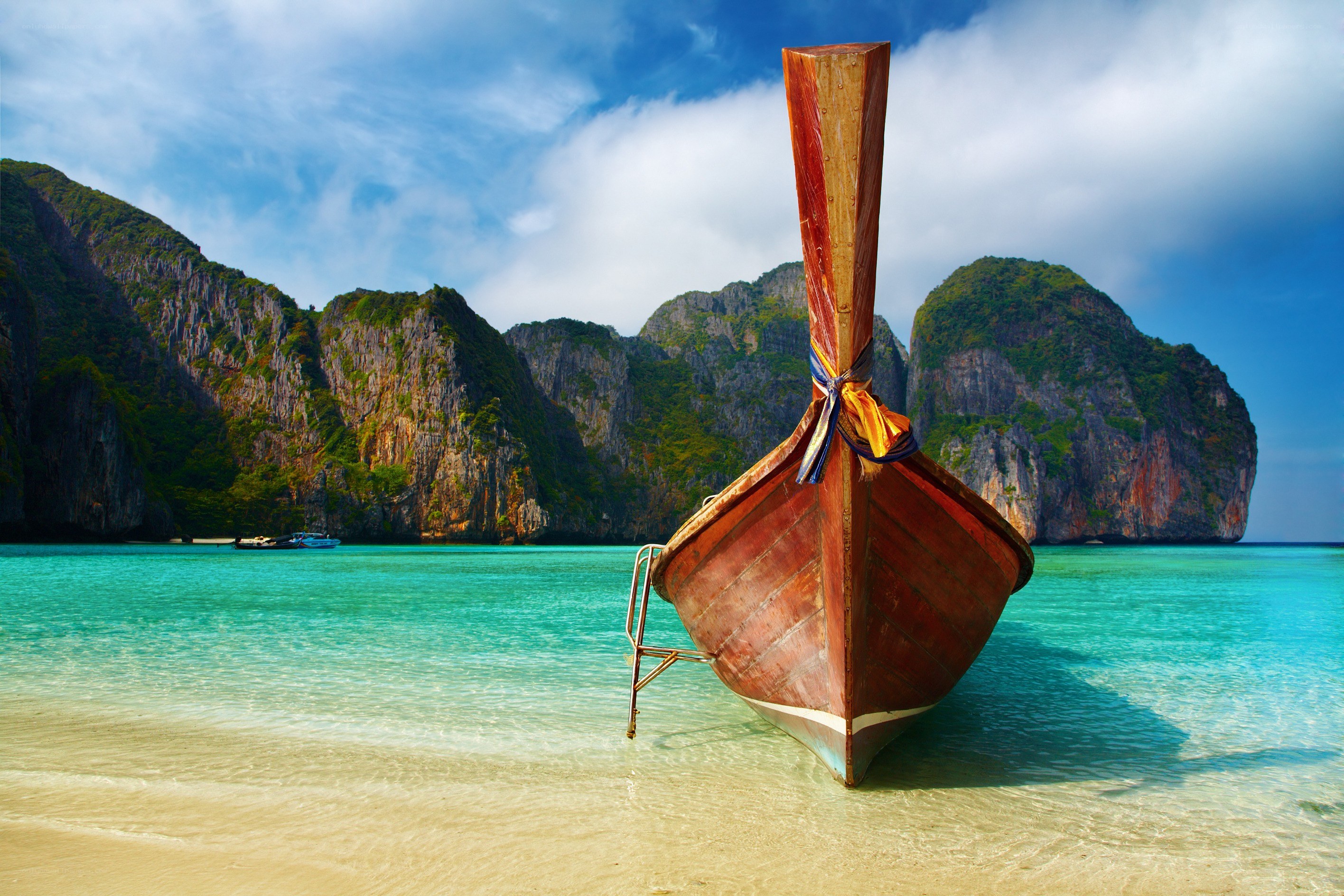 Longtail boat on tropical beach