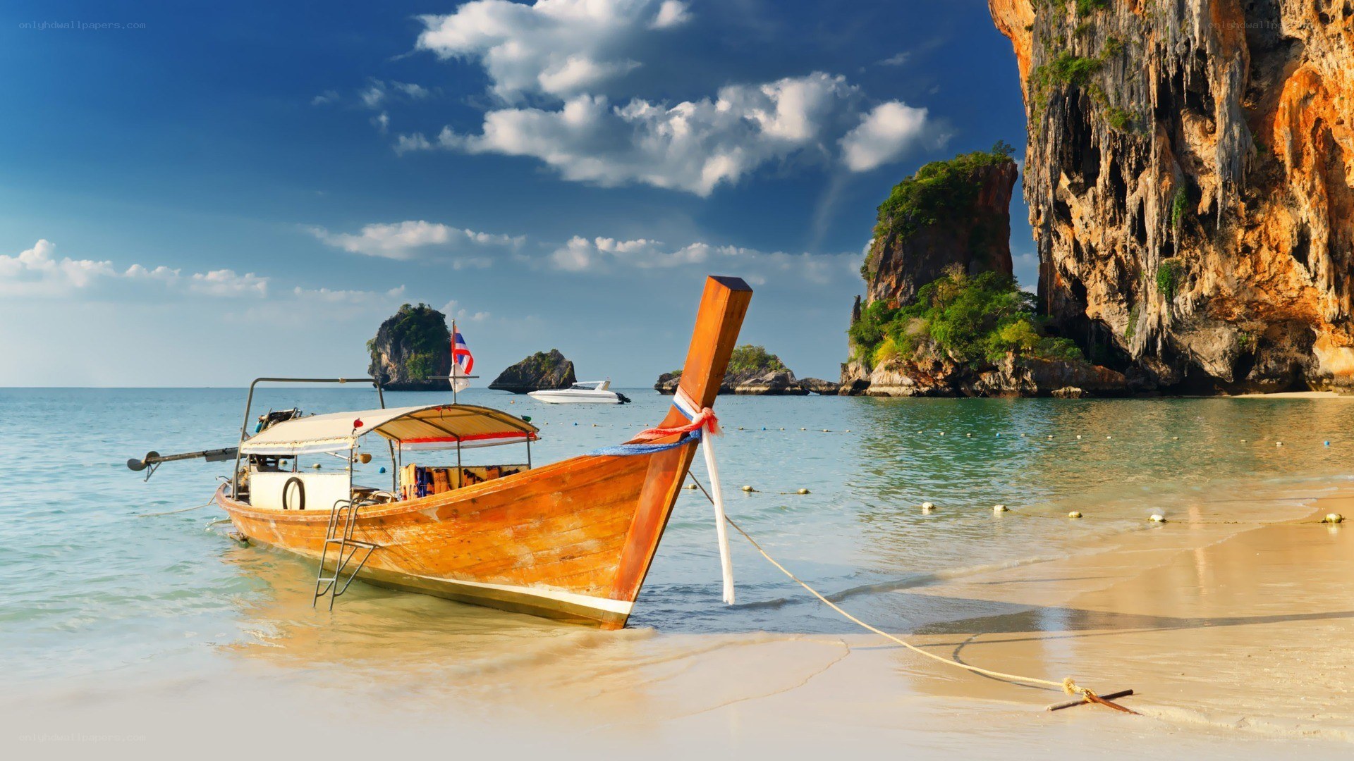 Longtail boat on tropical beach