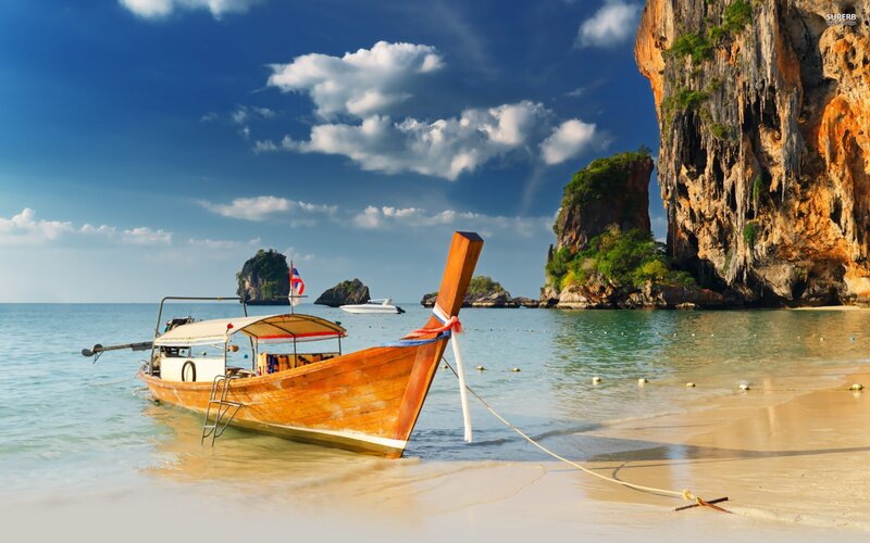 Longtail boat on tropical beach