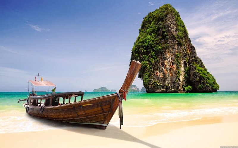 Longtail boat on tropical beach
