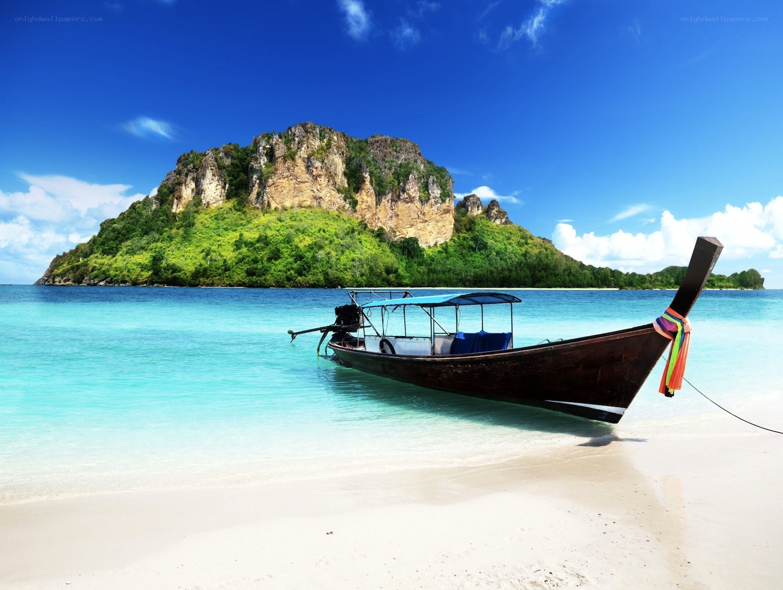 Longtail boat on tropical beach