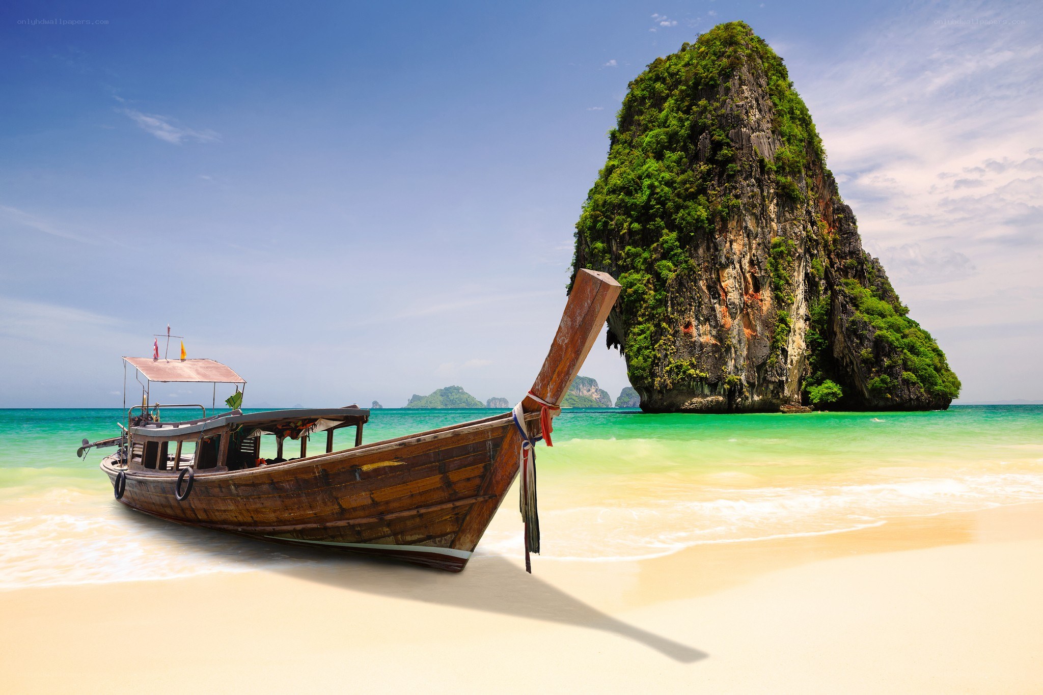 Longtail boat on tropical beach