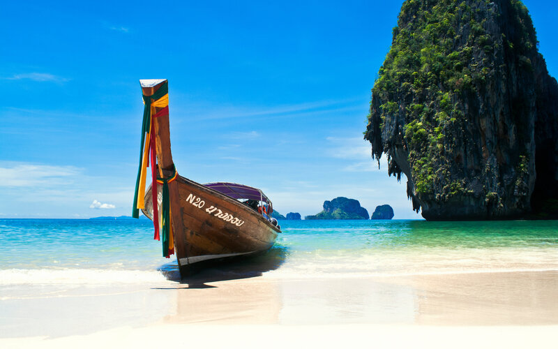 Longtail boat on tropical beach