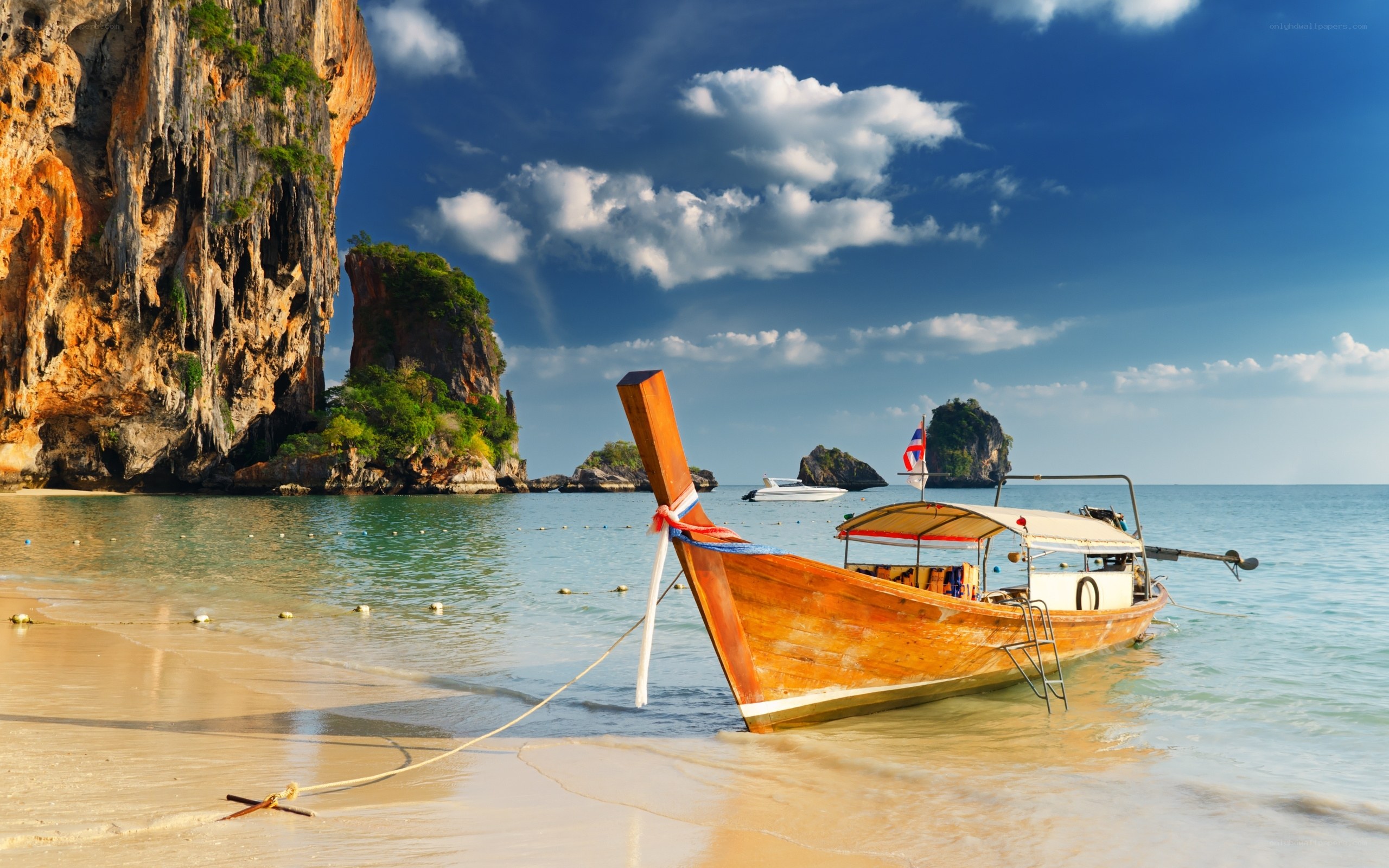 Longtail boat on tropical beach