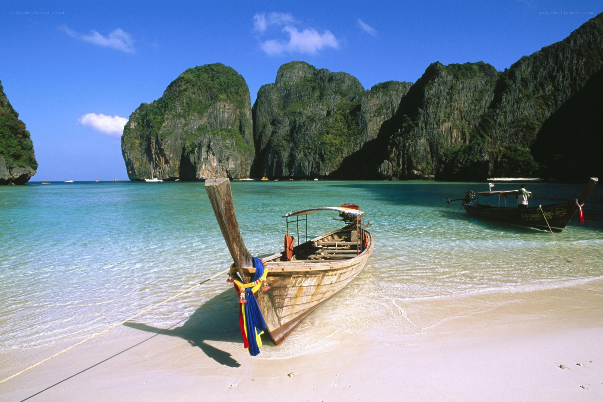 Longtail boat on tropical beach