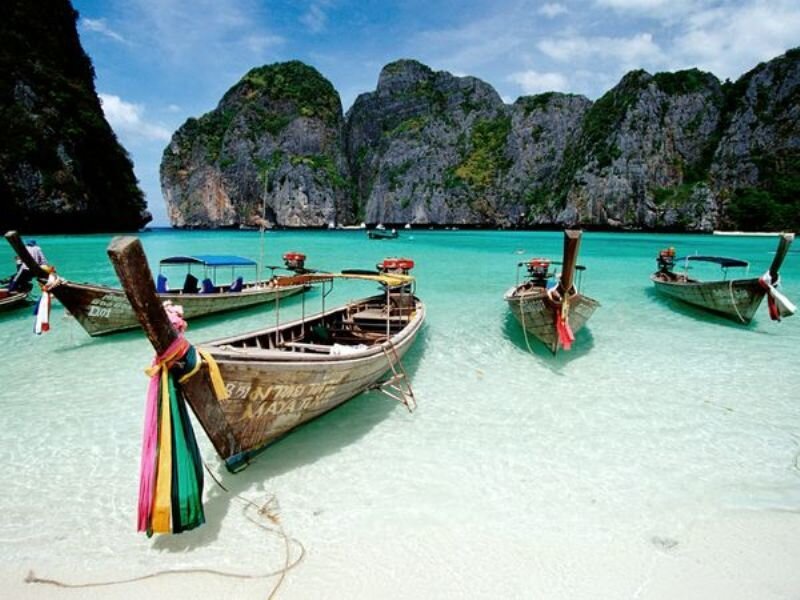 Longtail Boats in Turquoise Water — Serene