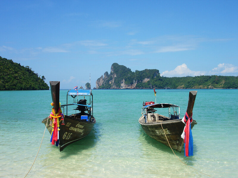 Longtail Boats in Water