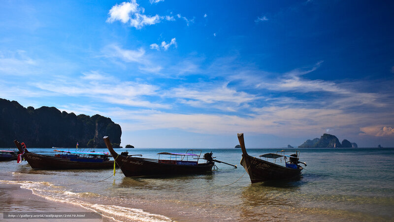Longtail boats on a tropical beach