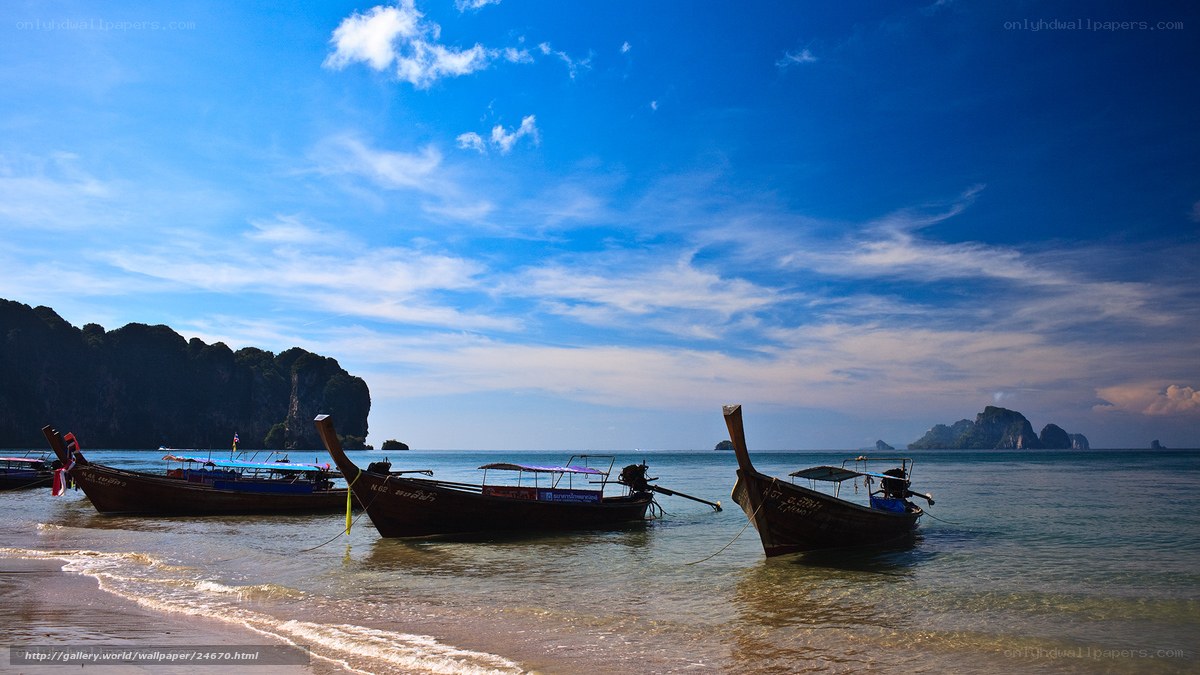 Longtail boats on a tropical beach