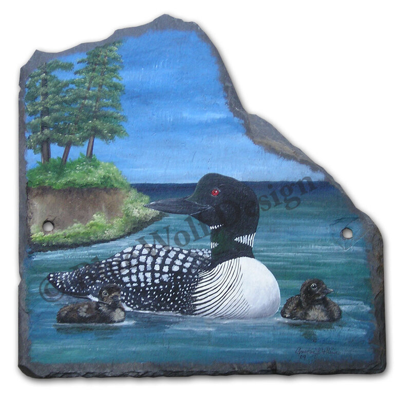 Loon with chicks on lake