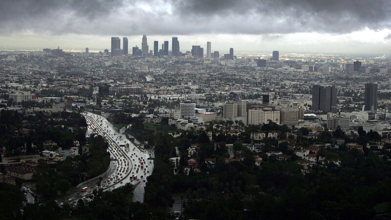 Los Angeles cityscape under storm clouds