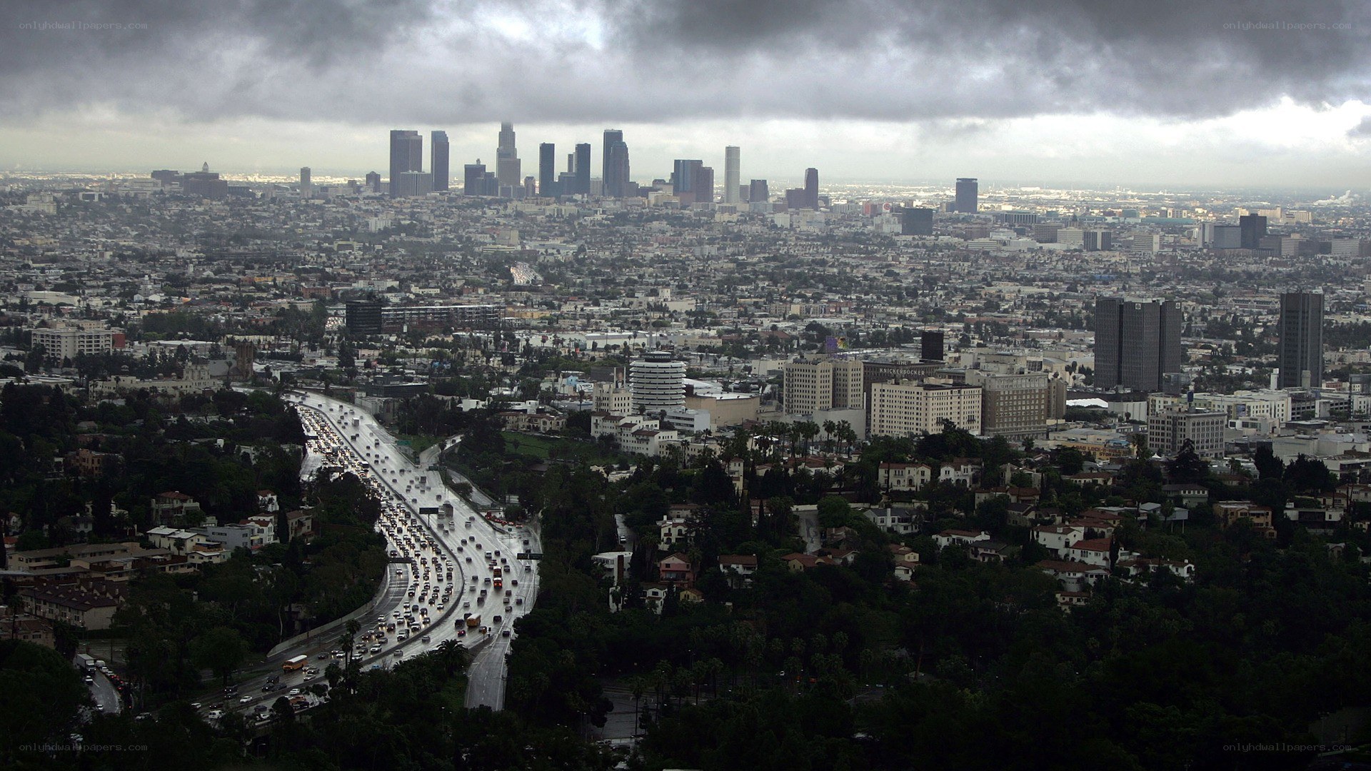 Los Angeles cityscape under storm clouds