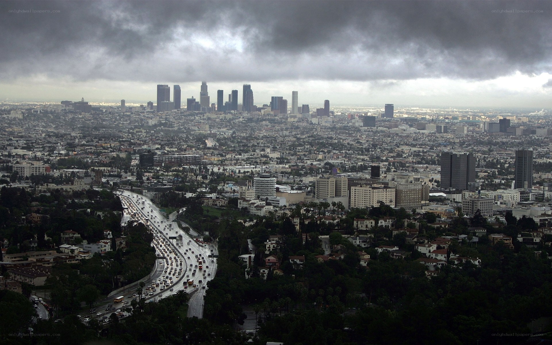 Los Angeles skyline under storm clouds